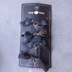 2/$10  4 Piece Black Bow Set With Skeleton Hand Charms